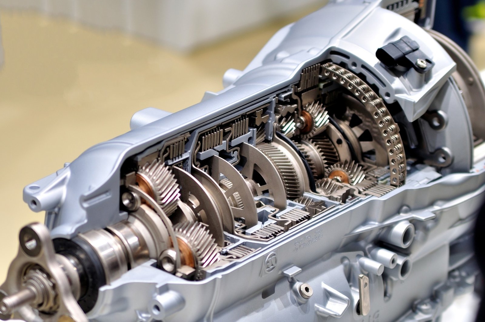 a close up of a car engine with gears and gears